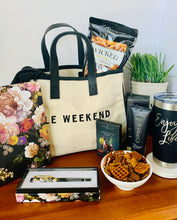 Load image into Gallery viewer, Let her know that you got her by treating her to this loaded gift that&#39;s packaged in a trendy canvas tote.  It includes a deluxe floral journal/diary with matching pen, ultra hydrating hand crème, 20oz. &quot;Enjoy Life&quot; Tumbler, Spicy Snack Mix, Cosmo drink mix (make 2-3 glasses), and an oversized scarf (choose plum or black).  Gift you wife, your bestfriend, sister, mother, girlfriend, or aunt.  Gifts for her. Travel gift
